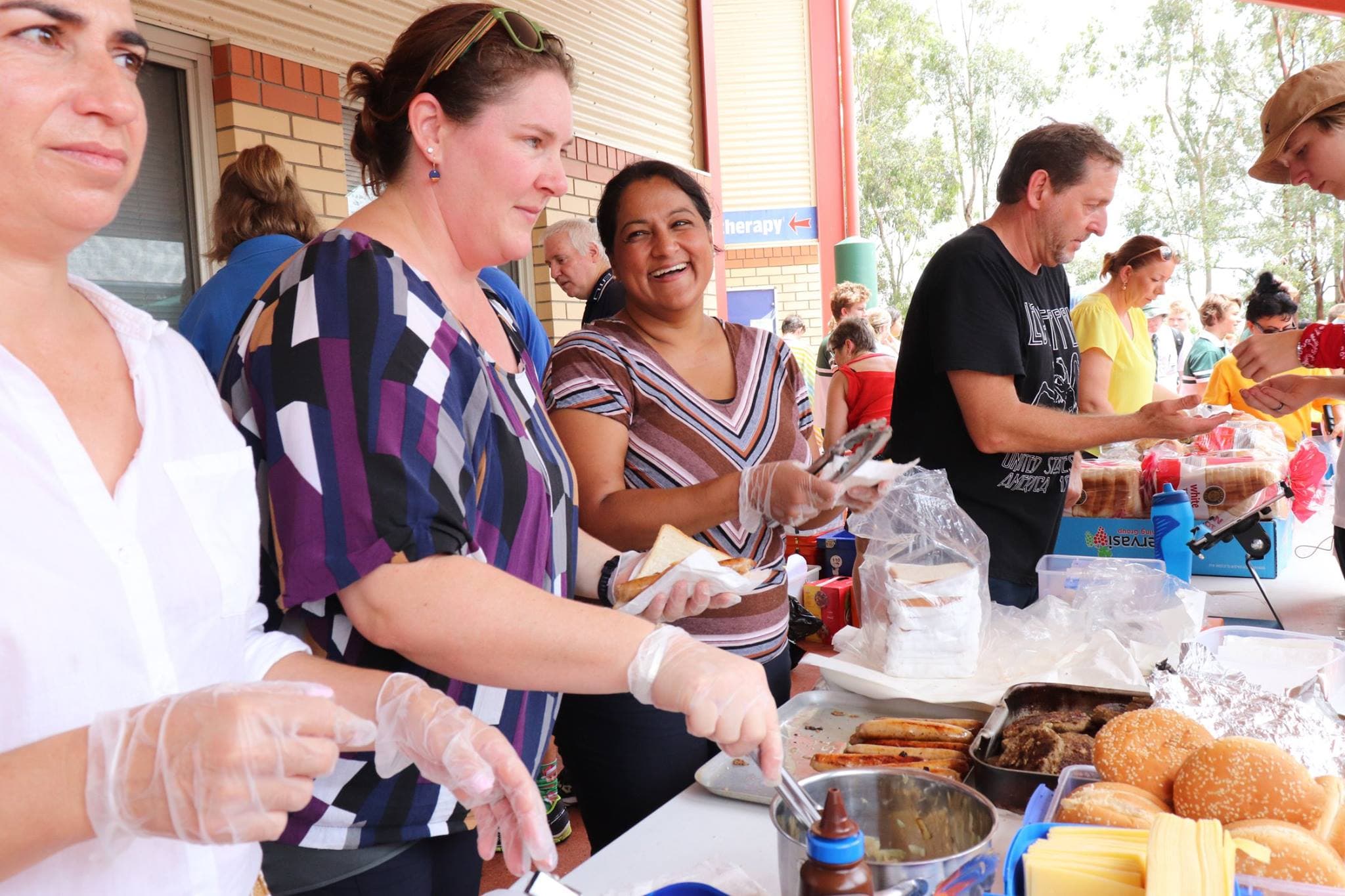 Parents and volunteers running the P&C BBQ